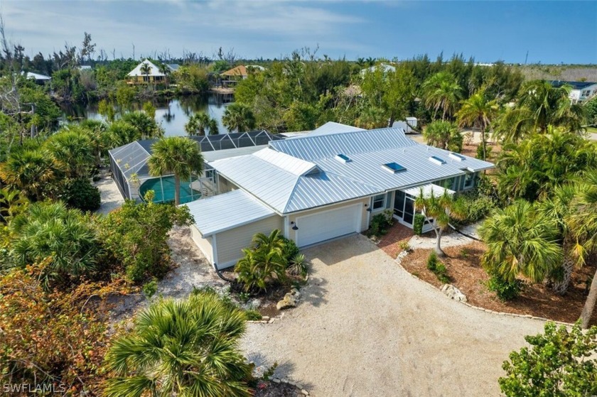 This charming ground level home has been totally redone and is - Beach Home for sale in Sanibel, Florida on Beachhouse.com