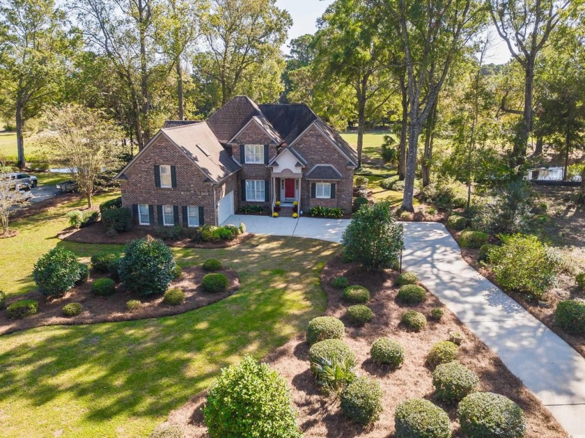 This beautiful all brick home with loads of curb appeal in the - Beach Home for sale in Pawleys Island, South Carolina on Beachhouse.com