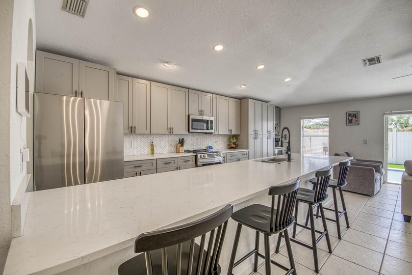 Beautifully updated 4-bedroom, 2-bath home featuring a brand-new - Beach Home for sale in West Palm Beach, Florida on Beachhouse.com