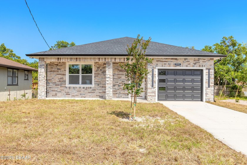 Discover this stunning NEW CONSTRUCTION home in the heart of - Beach Home for sale in Daytona Beach, Florida on Beachhouse.com