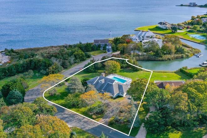 Enjoy lovely water views from this custom-built home on 3/4 acre - Beach Home for sale in Remsenburg, New York on Beachhouse.com