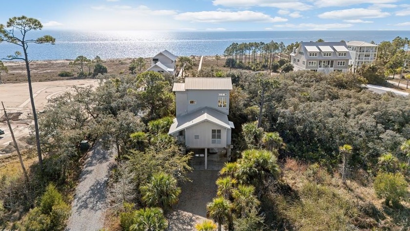 Custom-designed and thoughtfully positioned, this beachfront - Beach Home for sale in Port St Joe, Florida on Beachhouse.com