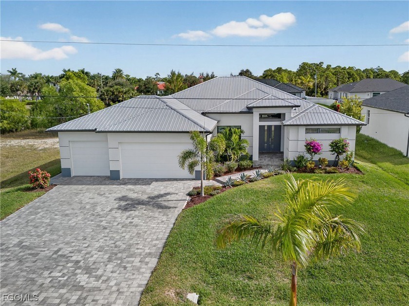 PRIME WATERFRONT IN CAPE CORAL! CONTEMPORARY 3 BEDROOM PLUS DEN - Beach Home for sale in Cape Coral, Florida on Beachhouse.com