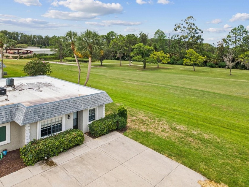 Nestled on the first hole of the Little Course golf course, this - Beach Condo for sale in New Port Richey, Florida on Beachhouse.com
