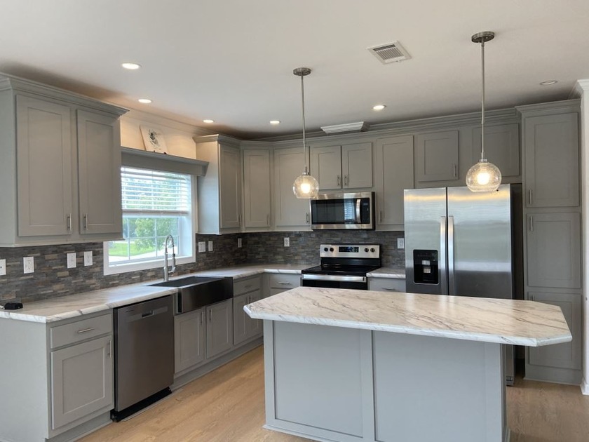 FREE RENT UNTIL 2026! WELCOME TO VILLAGE GREEN A 55+ - Beach Home for sale in Vero Beach, Florida on Beachhouse.com