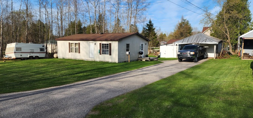 Walk to everything from this quiet in-town location! This - Beach Home for sale in Cedarville, Michigan on Beachhouse.com