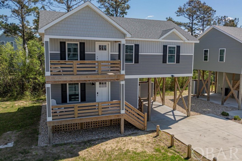 Experience the pinnacle of coastal living in this beautifully - Beach Home for sale in Kill Devil Hills, North Carolina on Beachhouse.com