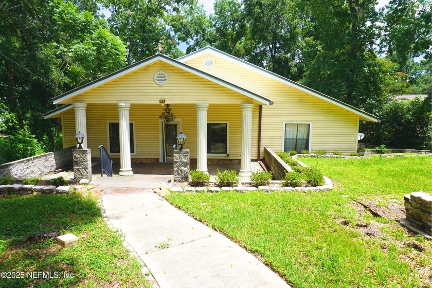 Experience true lakefront living on beautiful, spring-fed Lake - Beach Home for sale in Green Cove Springs, Florida on Beachhouse.com