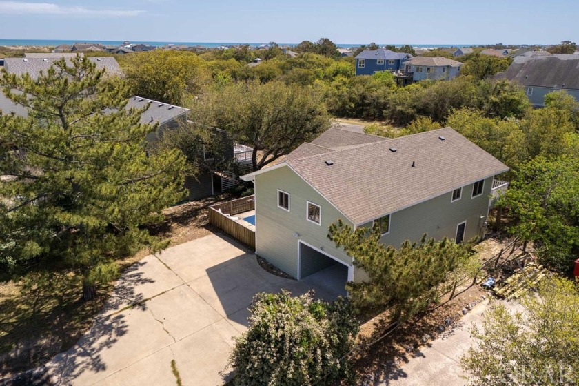Introducing this elevated oceanside retreat nestled in a quiet - Beach Home for sale in Corolla, North Carolina on Beachhouse.com