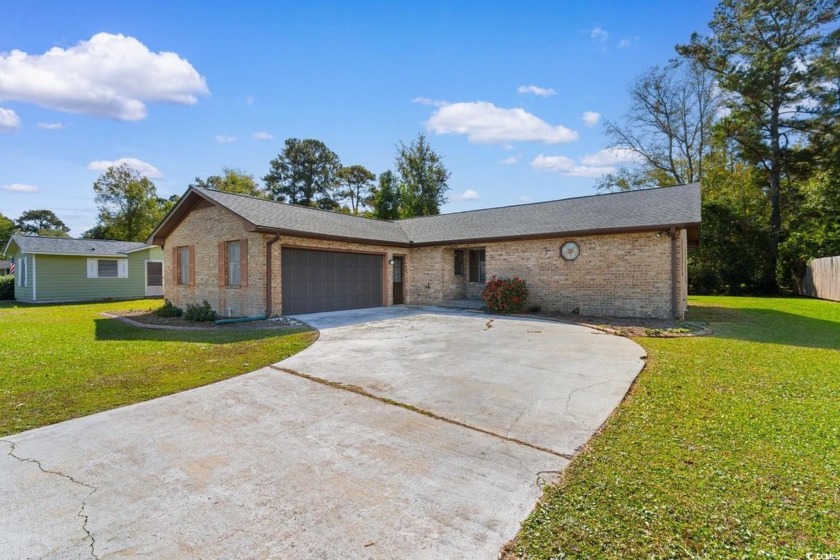 This 3-bedroom, 2-bath home is in a voluntary LOW or NO HOA just - Beach Home for sale in Surfside Beach, South Carolina on Beachhouse.com