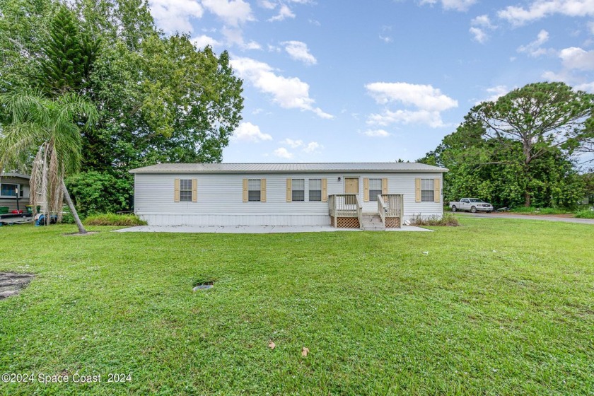 PRICE ADJUSTED! Beautiful 3 Bedroom 2 Bath Manufactured Home on - Beach Home for sale in Merritt Island, Florida on Beachhouse.com