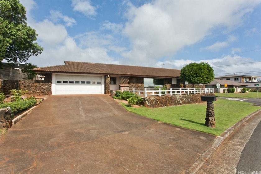 Admired for its expansive design and inviting curb appeal, this - Beach Home for sale in Pearl City, Hawaii on Beachhouse.com