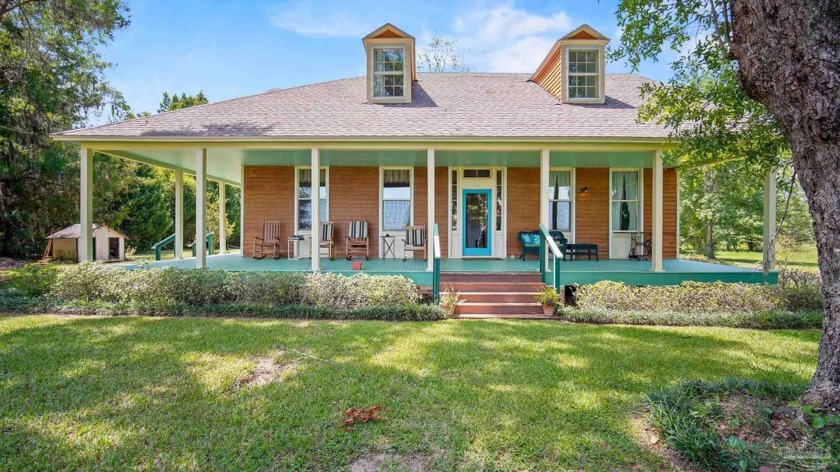 This hidden Greek Revival gem is located in the village of - Beach Home for sale in Milton, Florida on Beachhouse.com