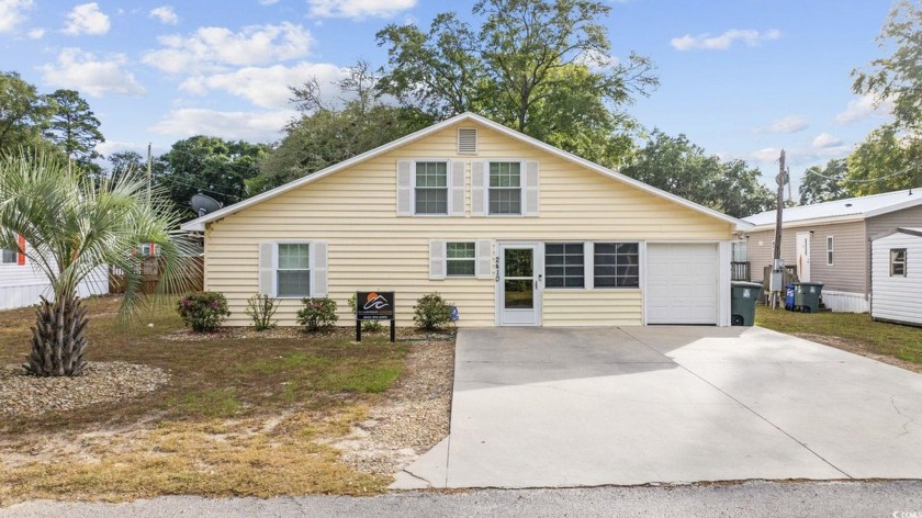 Welcome to 2410 Douglas St., a versatile 4-bedroom, 3-bathroom - Beach Home for sale in North Myrtle Beach, South Carolina on Beachhouse.com