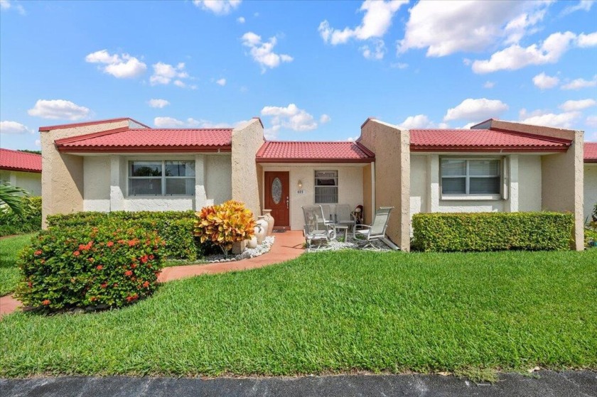 This 2-bedroom, 2-bath corner first-floor villa in the 55+ - Beach Home for sale in West Palm Beach, Florida on Beachhouse.com