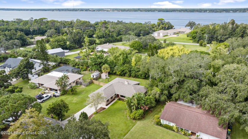 Nestled between the Indian and Banana Rivers, this updated home - Beach Home for sale in Merritt Island, Florida on Beachhouse.com