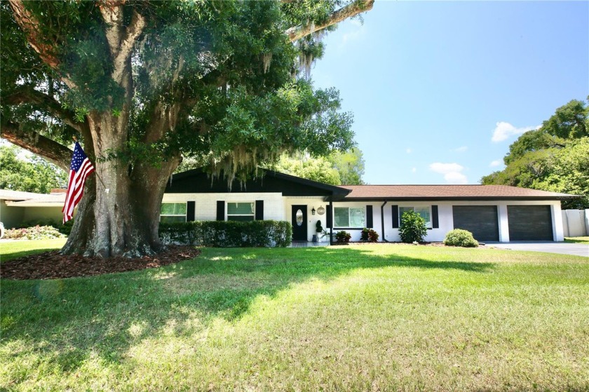 This beautifully remodeled lakefront home shows amazing! Nestled - Beach Home for sale in Tampa, Florida on Beachhouse.com