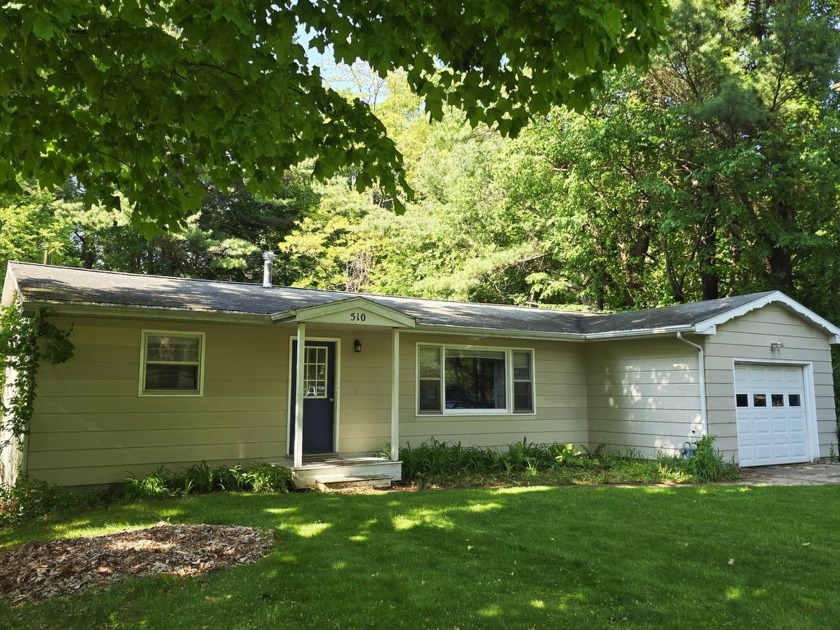 Welcome to this inviting and affordable home nestled in the - Beach Home for sale in Whitehall, Michigan on Beachhouse.com
