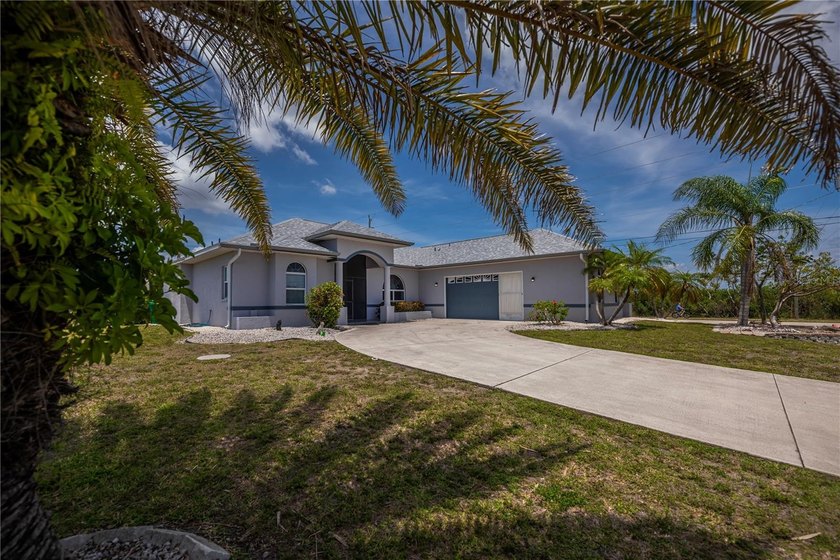 EXPERIENCE SERENE LAGOON WATER VIEWS FROM NEARLY EVERY ROOM in - Beach Home for sale in Port Charlotte, Florida on Beachhouse.com