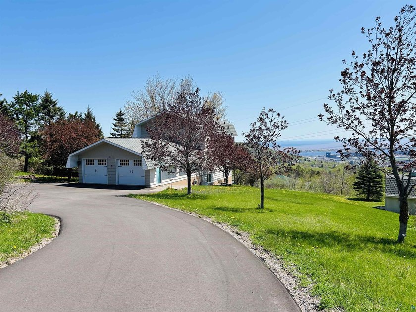 Perched on top of Duluth, this Exhibition Drive home offers - Beach Home for sale in Duluth, Minnesota on Beachhouse.com