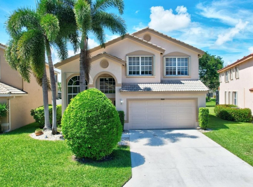 This charming two-story home boasts a gorgeous lake view and a - Beach Home for sale in Boynton Beach, Florida on Beachhouse.com