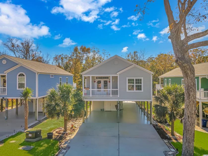 Welcome to this newly-built raised home, just minutes from the - Beach Home for sale in North Myrtle Beach, South Carolina on Beachhouse.com