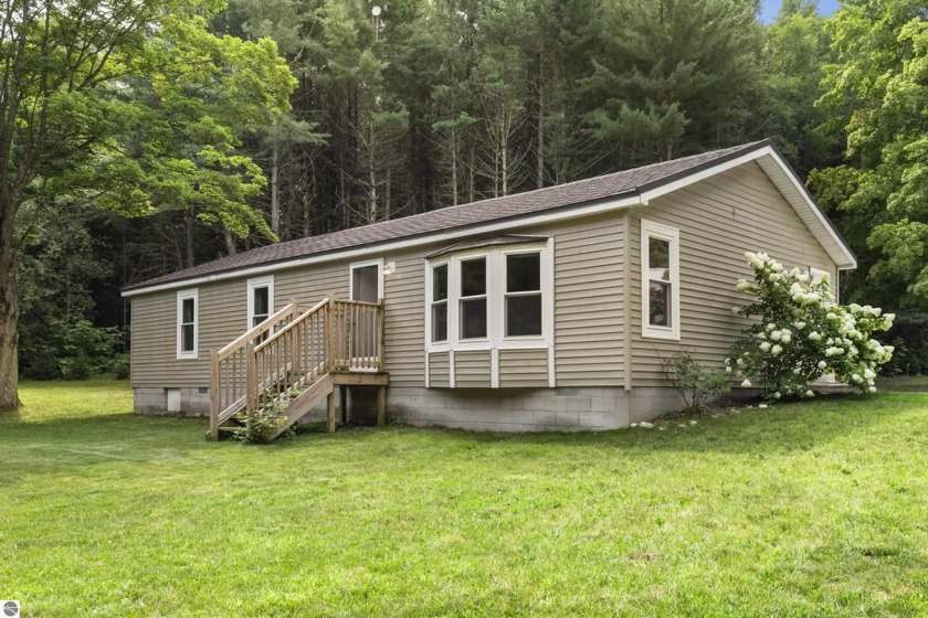 Take in the scenic countryside from this 3-bedroom, 2-bathroom - Beach Home for sale in Arcadia, Michigan on Beachhouse.com