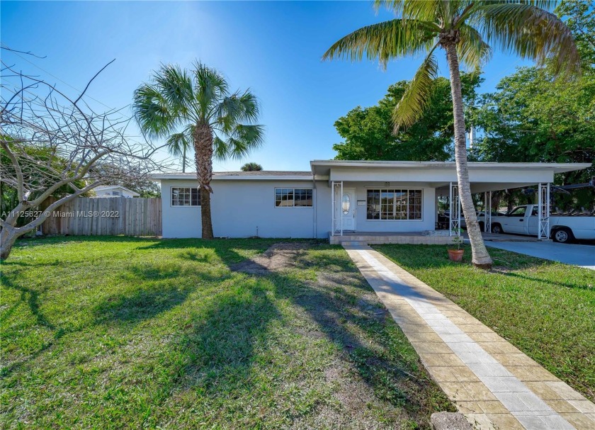 BEAUTIFULLY UPDATED 3 BEDROOM AND 2 BATHROOM HOME SITTING ON A - Beach Home for sale in Pompano Beach, Florida on Beachhouse.com