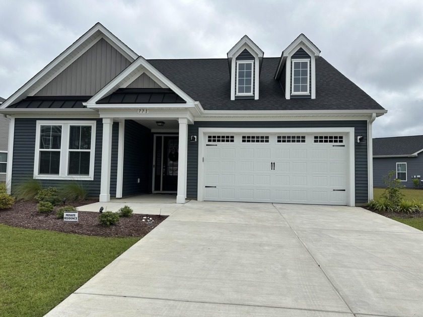 Enjoy sitting on your patio overlooking the lake views with this - Beach Home for sale in Little River, South Carolina on Beachhouse.com