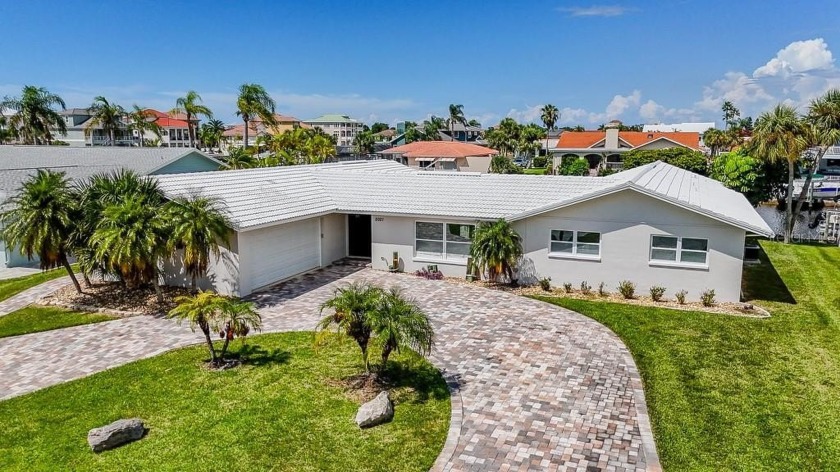 Coastal luxury meets resort-style living in this updated 3,000 - Beach Home for sale in New Port Richey, Florida on Beachhouse.com