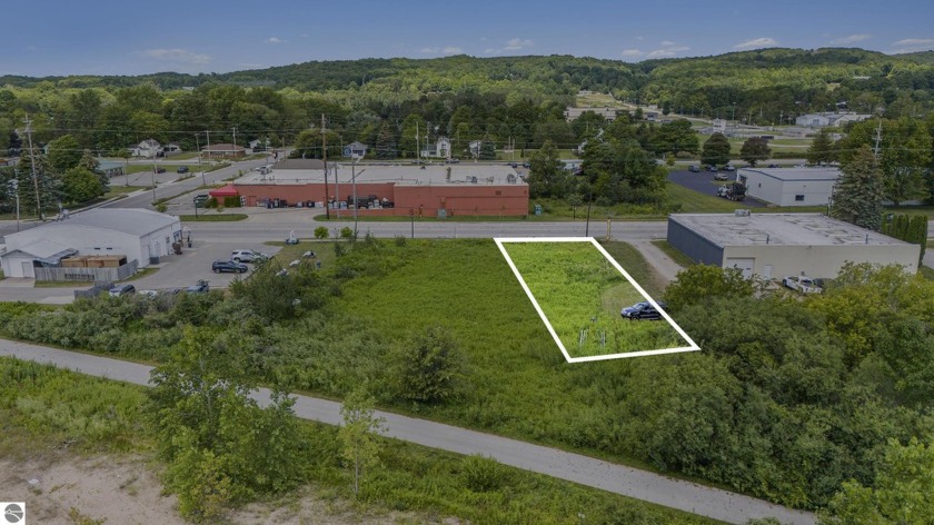 Welcome to an exceptional opportunity to own a prime mixed-use - Beach Lot for sale in Frankfort, Michigan on Beachhouse.com