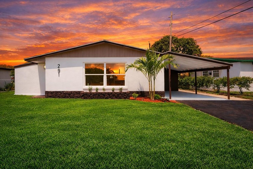 Step into a home where *renovated* is an understatement-it's - Beach Home for sale in Riviera Beach, Florida on Beachhouse.com