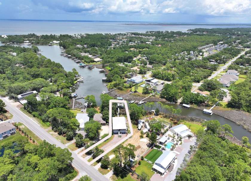 Welcome to your dream waterfront property! This magnificent 4 - Beach Home for sale in Santa Rosa Beach, Florida on Beachhouse.com