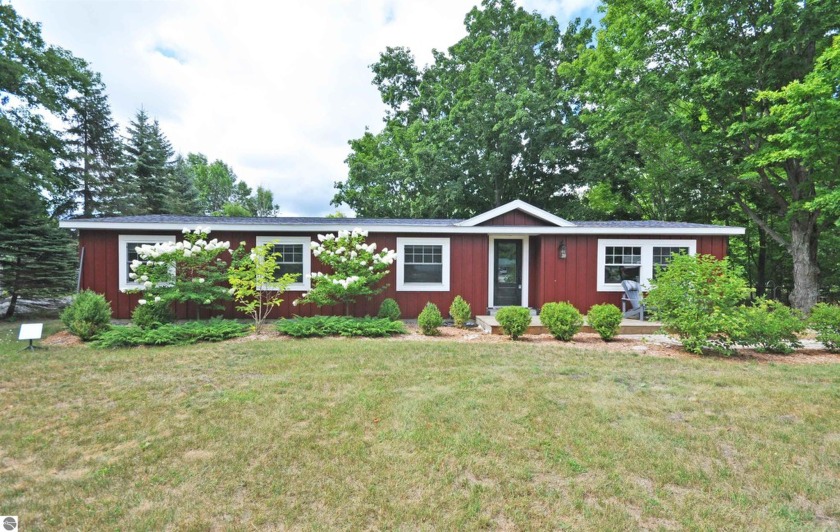 Fantastic location! This three bedroom, two bathroom ranch has - Beach Home for sale in Maple City, Michigan on Beachhouse.com