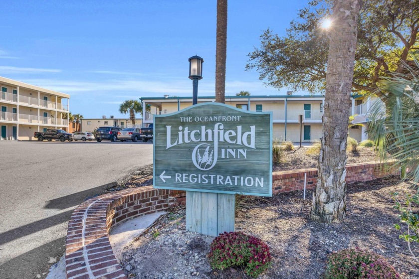 Located on the pristine sands of Litchfield Beach, this charming - Beach Condo for sale in Pawleys Island, South Carolina on Beachhouse.com