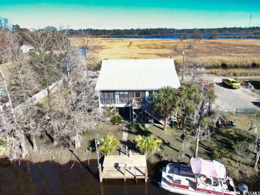 Welcome to 72 Catfish Lane, a rare waterfront opportunity in the - Beach Home for sale in Georgetown, South Carolina on Beachhouse.com