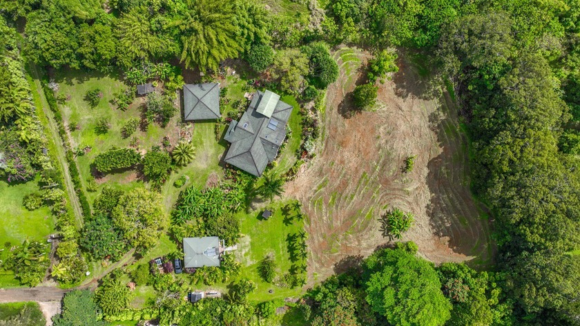 Just over 2.5 acres of tropical serenity await... This - Beach Home for sale in Kapaa, Hawaii on Beachhouse.com