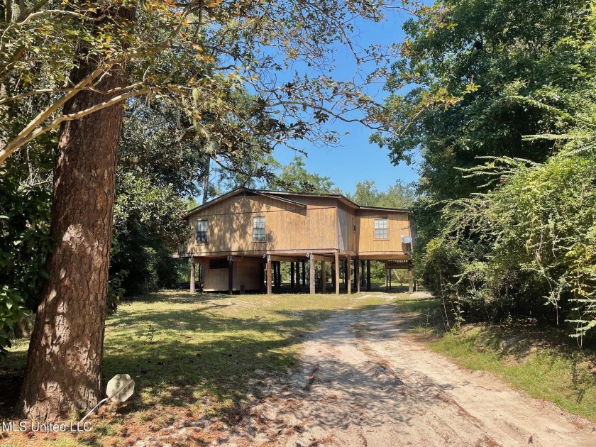 Very private waterfront house/camp. Large living/dining room - Beach Home for sale in Biloxi, Mississippi on Beachhouse.com