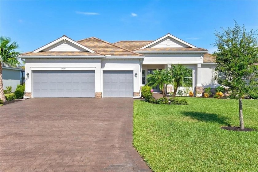 Tucked behind the gates of Harbor West, this exceptional - Beach Home for sale in Port Charlotte, Florida on Beachhouse.com
