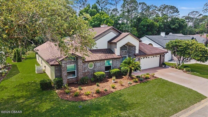 This pool home is located in Breakaway Trails, a sought after - Beach Home for sale in Ormond Beach, Florida on Beachhouse.com