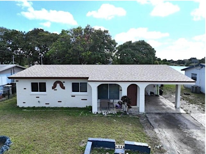 Enjoy tranquil lake views and peace of mind in this beautiful - Beach Home for sale in Pompano Beach, Florida on Beachhouse.com