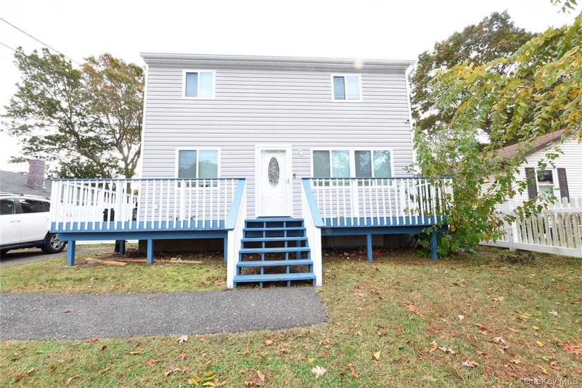 Step into this beautifully updated Colonial that perfectly - Beach Home for sale in Mastic Beach, New York on Beachhouse.com
