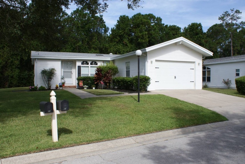 This spacious two-bedroom, two-bath home with a family room has - Beach Home for sale in Ormond Beach, Florida on Beachhouse.com