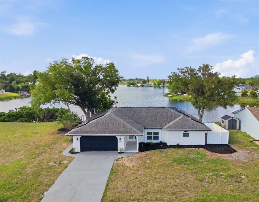 3 Bed | 2 Bath | 1,663 SqFt | 2-Car Garage | LAKEFRONT with - Beach Home for sale in North Port, Florida on Beachhouse.com