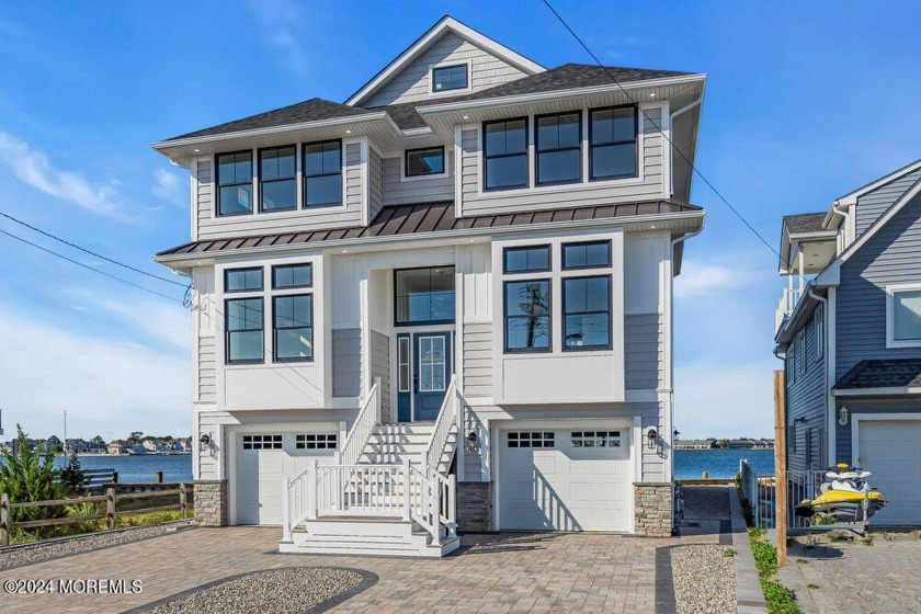 This stunning bayfront new construction offers 5 bedrooms, 4 - Beach Home for sale in Brick, New Jersey on Beachhouse.com