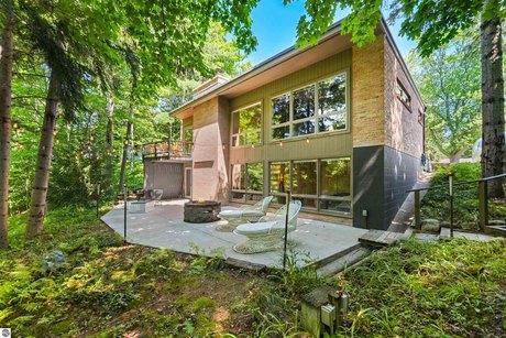 An authentic mid-century (1965) home overlooking 100'+ of the - Beach Home for sale in Northport, Michigan on Beachhouse.com