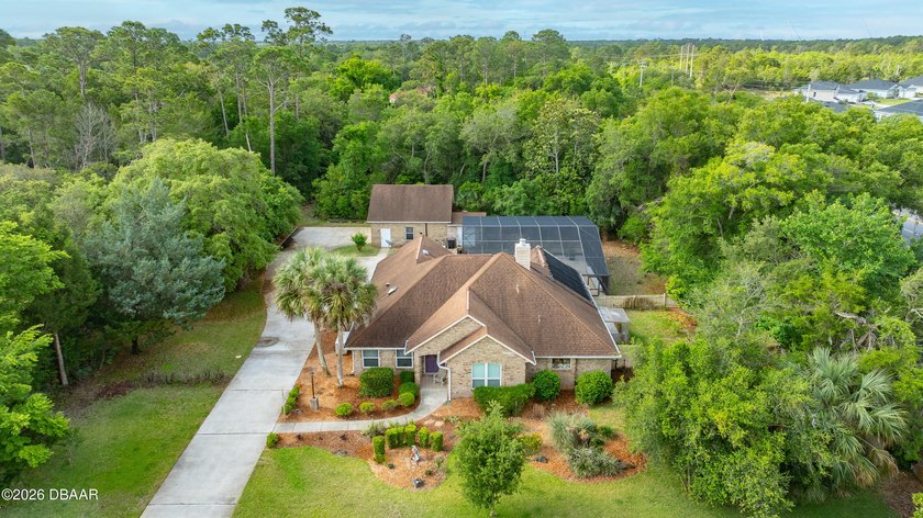 Rare opportunity to own BOTH a beautifully situated home and an - Beach Home for sale in Ormond Beach, Florida on Beachhouse.com