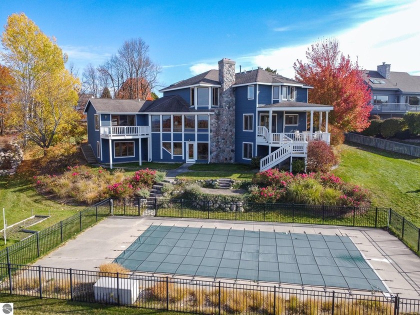 Perfectly situated at the base of Old Mission Peninsula, this - Beach Home for sale in Traverse City, Michigan on Beachhouse.com