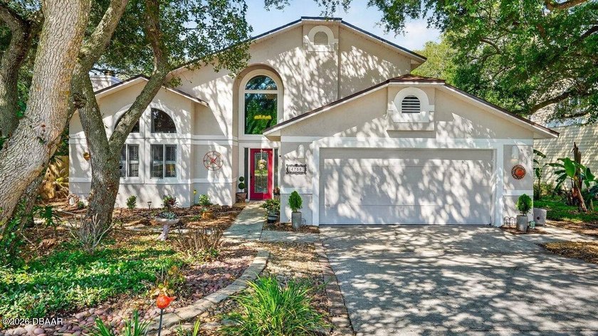 Tucked beneath a canopy of mature oaks and stretching toward the - Beach Home for sale in Ponce Inlet, Florida on Beachhouse.com
