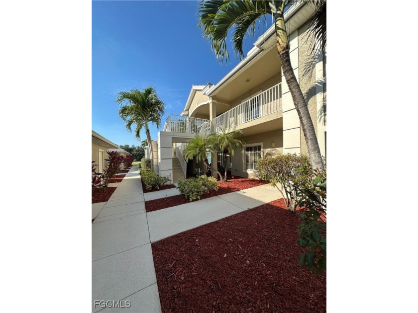 This 2nd-floor end-unit condo is shaded by mature trees and - Beach Condo for sale in Lehigh Acres, Florida on Beachhouse.com